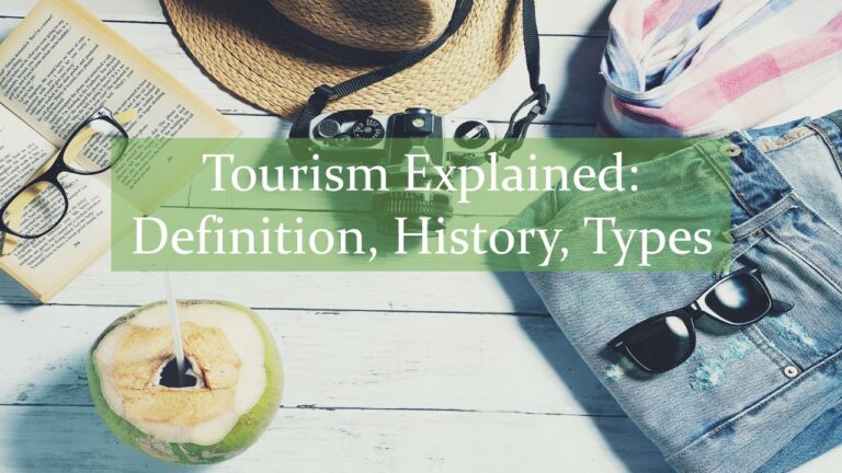 photograph of travel items book, glasses, brown straw hat, pink scarf, blue jeans, dark sunglasses and green coconut on wood with words tourism explained, definition, history, types written in green box